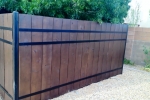 Steel and wood privacy fence