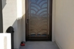 Custom arched Geometric style security door.